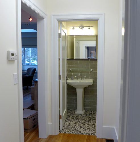 This multi-room Bellingham home remodel resulted in a new powder room, a conjoined master bedroom and office, an expanded master bathroom and improvements to the living room.