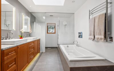 Project feature: Bathroom remodel features new materials in original layout