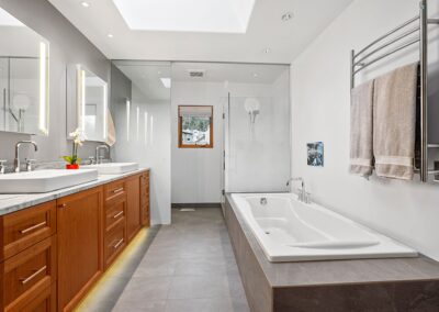 Project feature: Bathroom remodel features new materials in original layout